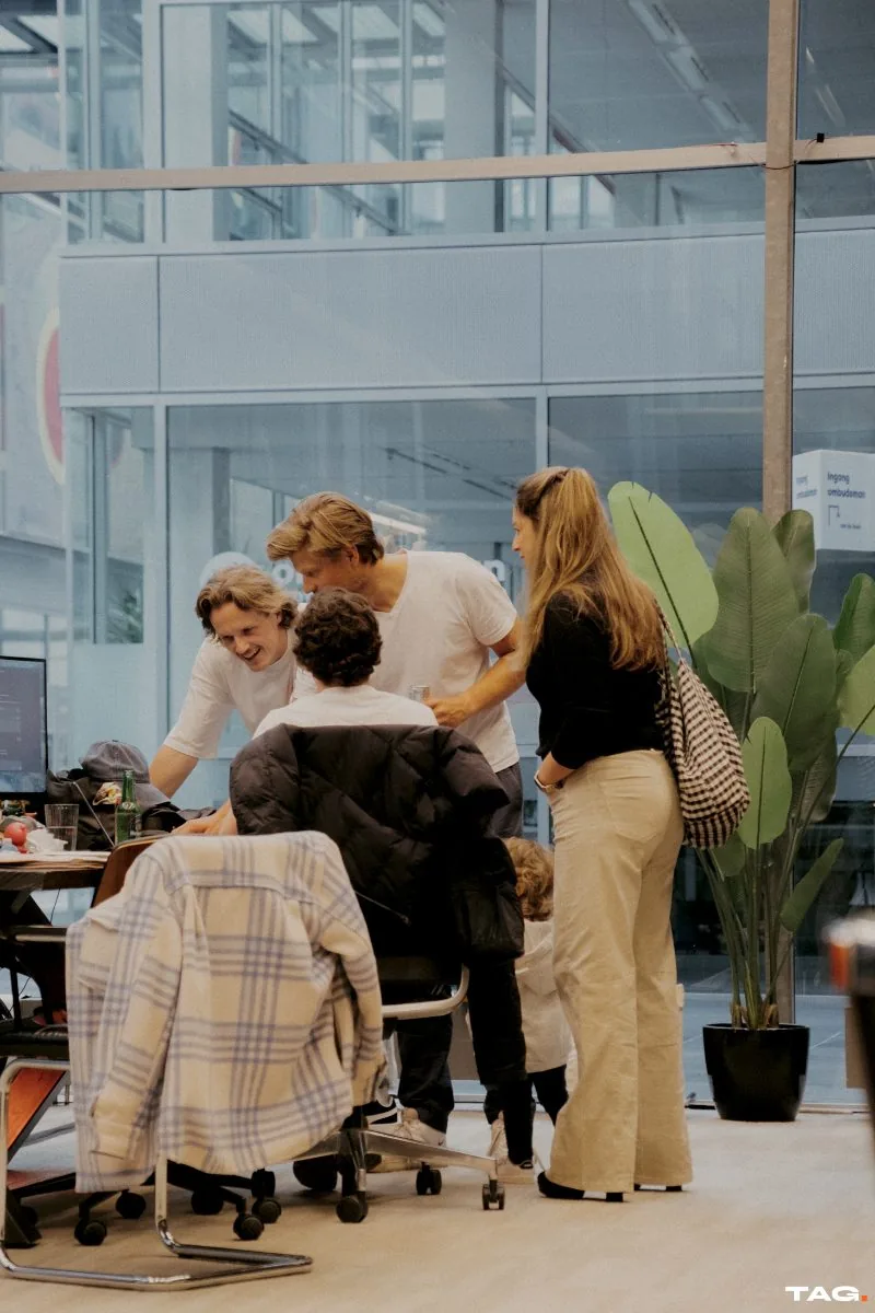 Crowding round a laptop
